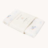 Avery Row Coastline baby Muslin Swaddle. The swaddle features a delicate coastline print that has corals and little blue fish. Avery Row have a collection of stylish nursery and baby essentials available at Babipur.