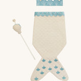 A light Avery row mermaid dress up set with a light blue trim including a light blue crown and a light shell wand on a cream background.