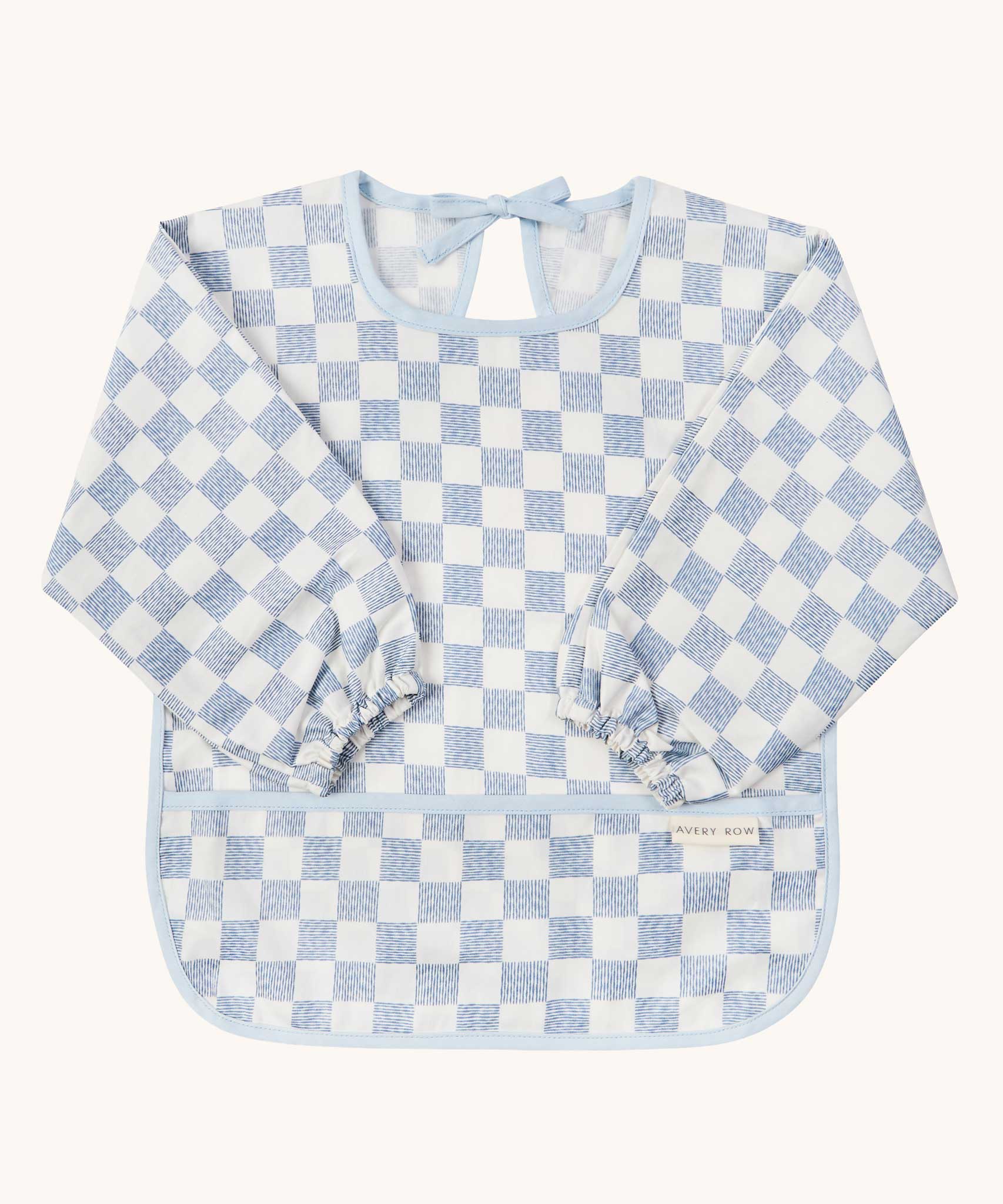 Avery Row Sleeved Bib with a check Waves design. This blue and white coloured bib has long sleeves with elasticated cuffs and features a pocket to help catch any food debris. We have a wide range of Avery Row stylish baby products available at Babipur.