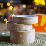 Stack of three brown paper tapes on a kitchen table.