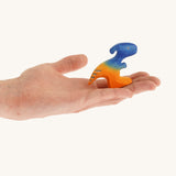 Blue and orange standing baby Parasaurolophus on a hand