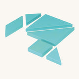 Bajo tangram puzzle set showing 7 blue wooden pieces in different geometric shapes