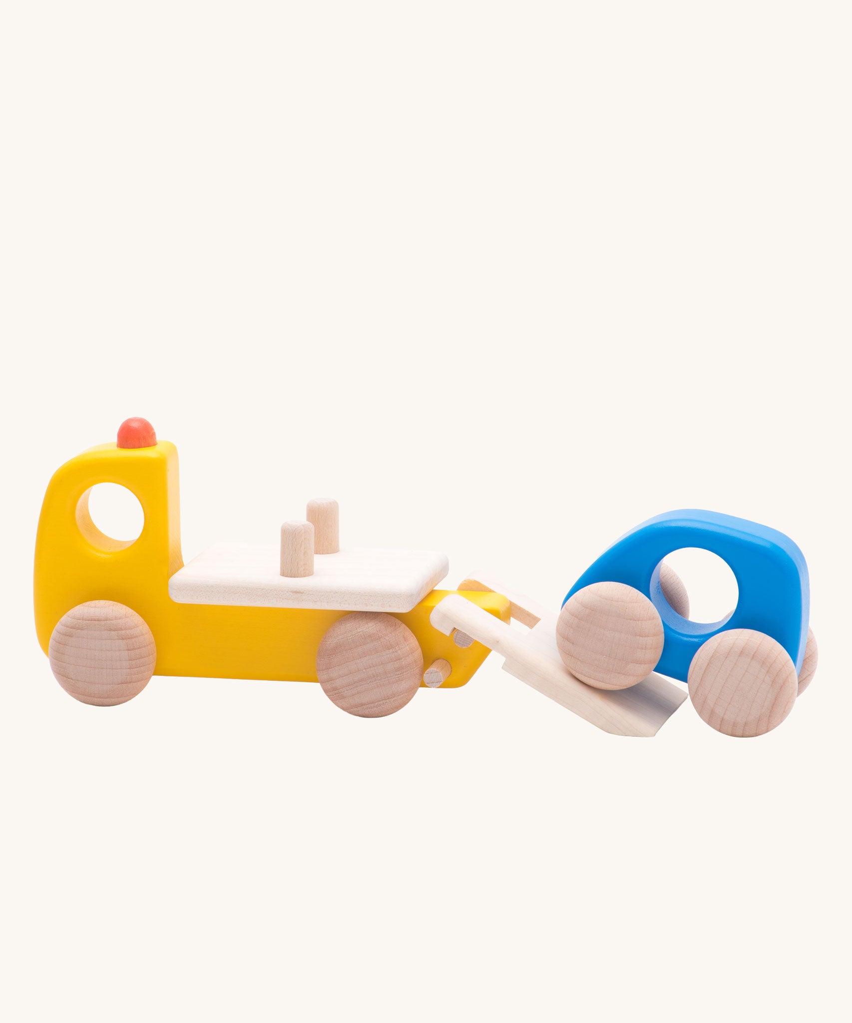 The car transporter from the Bajo emergency vehicle set. A yellow car transporter lorry that comes with a little blue wooden car. These heirloom quality toys by Bajo are part of a wide range of wooden toys available here at Babipur.