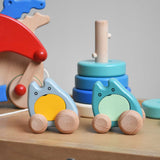 Two Bajo wooden push along ghost toy placed on Triclimb Miri slide with other Bajo toys behind them.
These heirloom quality wooden toys are part of a wide range available here at Babipur.