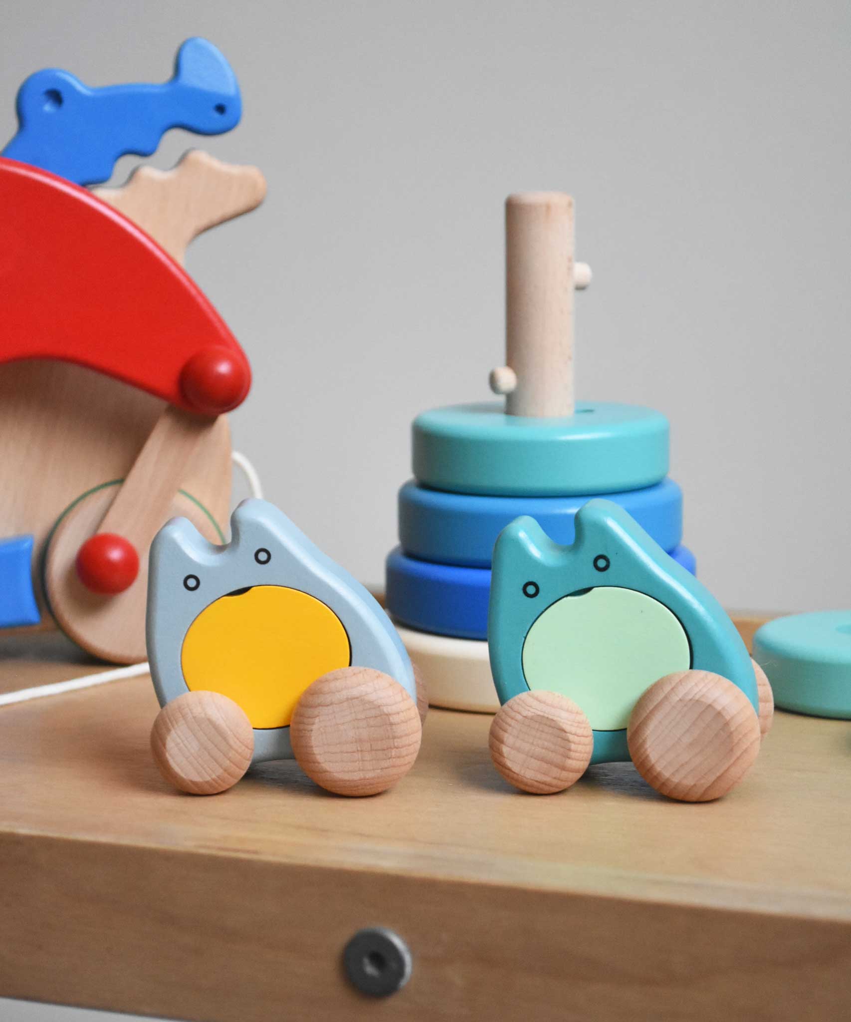 Two Bajo wooden push along ghost toy placed on Triclimb Miri slide with other Bajo toys behind them.
These heirloom quality wooden toys are part of a wide range available here at Babipur.
