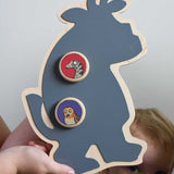 A Bajo owl and snake magnets placed on a Gruffalo shaped board. A close up of a Bajo gruffalo owl magnet stuck onto a Triclimb biri board. These magnets are part of a range of Bajo wooden toys available at Babipur.