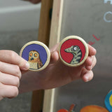 An owl and snake Bajo Gruffalo magnet in a child's hand. These magnets are part of a range of Bajo wooden toys available at Babipur.