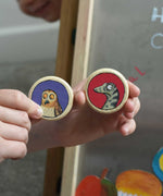 An owl and snake Bajo Gruffalo magnet in a child's hand. These magnets are part of a range of Bajo wooden toys available at Babipur.
