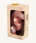 A wooden Gruffalo figure in a cardboard box on a cream background.