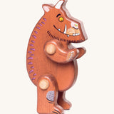 A wooden standing Gruffalo figure on a cream background