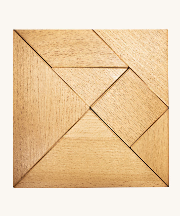 Bajo tangram puzzle set showing 7 natural wooden pieces in different geometric shapes