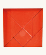 Bajo tangram puzzle set showing 7 red wooden pieces in different geometric shapes