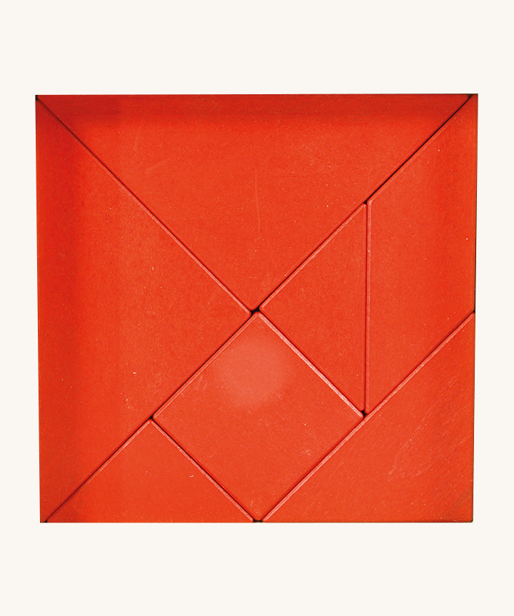 Bajo tangram puzzle set showing 7 red wooden pieces in different geometric shapes
