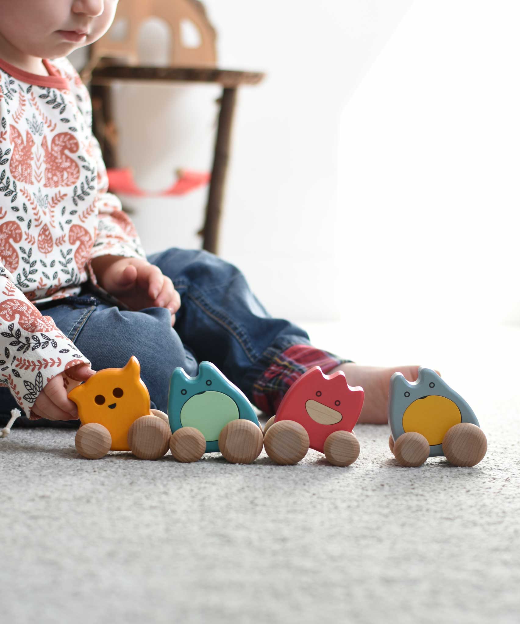 A child sitting on the floor with four Bajo wooden push along ghost toys placed in front of them.
These heirloom quality wooden toys are part of a wide range available here at Babipur.