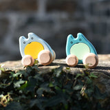 Two Bajo wooden push along ghost toys placed on a stone wall outdoors.
These heirloom quality wooden toys are part of a wide range available here at Babipur.