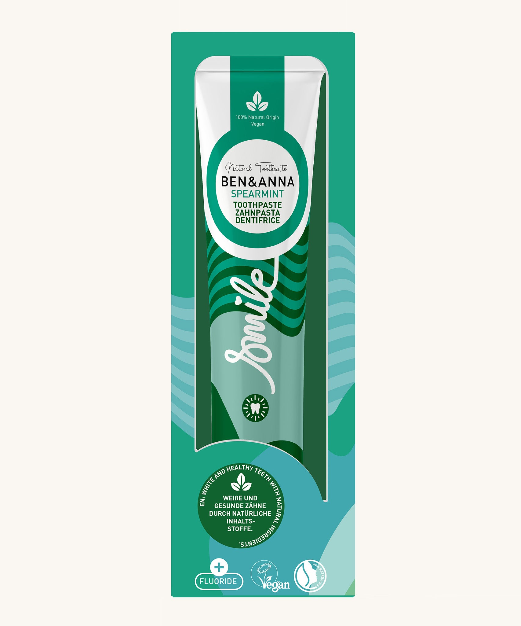 Ben & Anna spearmint toothpaste showing a green stripes and waves on the packaging with a playful smile slogan in white in the middle