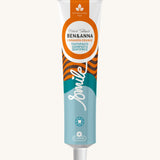 Ben & Anna certified 100% natural toothpaste in orange and cinnamon flavour showing a orange stripes with blue waves design on the tube. Features a playful smile slogan in white in the middle.