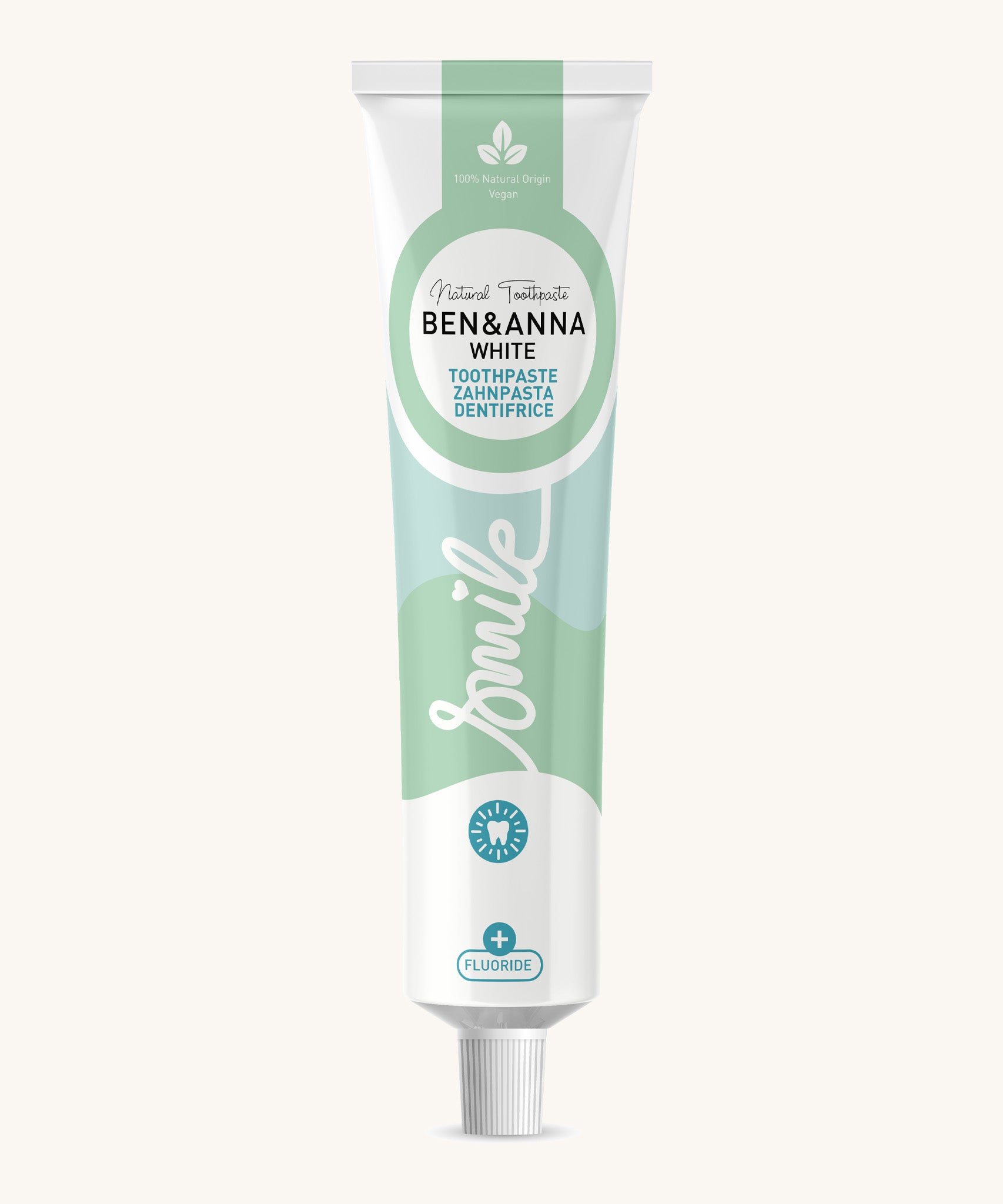 Ben & Anna certified 100% natural white toothpaste showing a green wave design on the tube with a playful smile slogan in white in the middle.