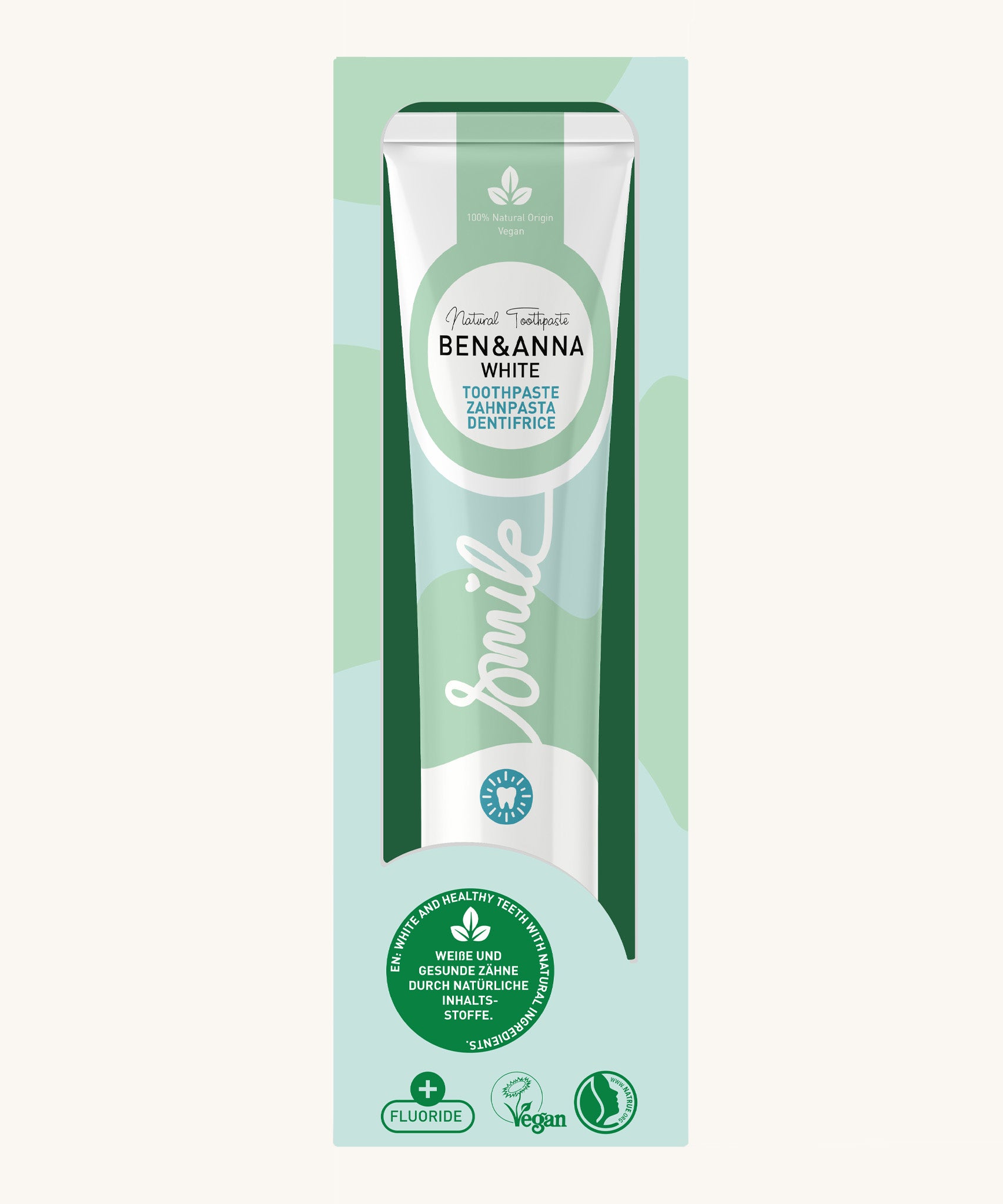 Ben & Anna white toothpaste showing a green wave design on the packaging with a playful smile slogan in white in the middle