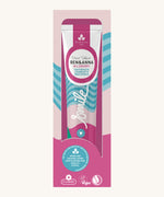 Ben & Anna wild berry toothpaste showing a blue stripe with pink and green wave design on the packing. Features a playful smile slogan in white in the middle.