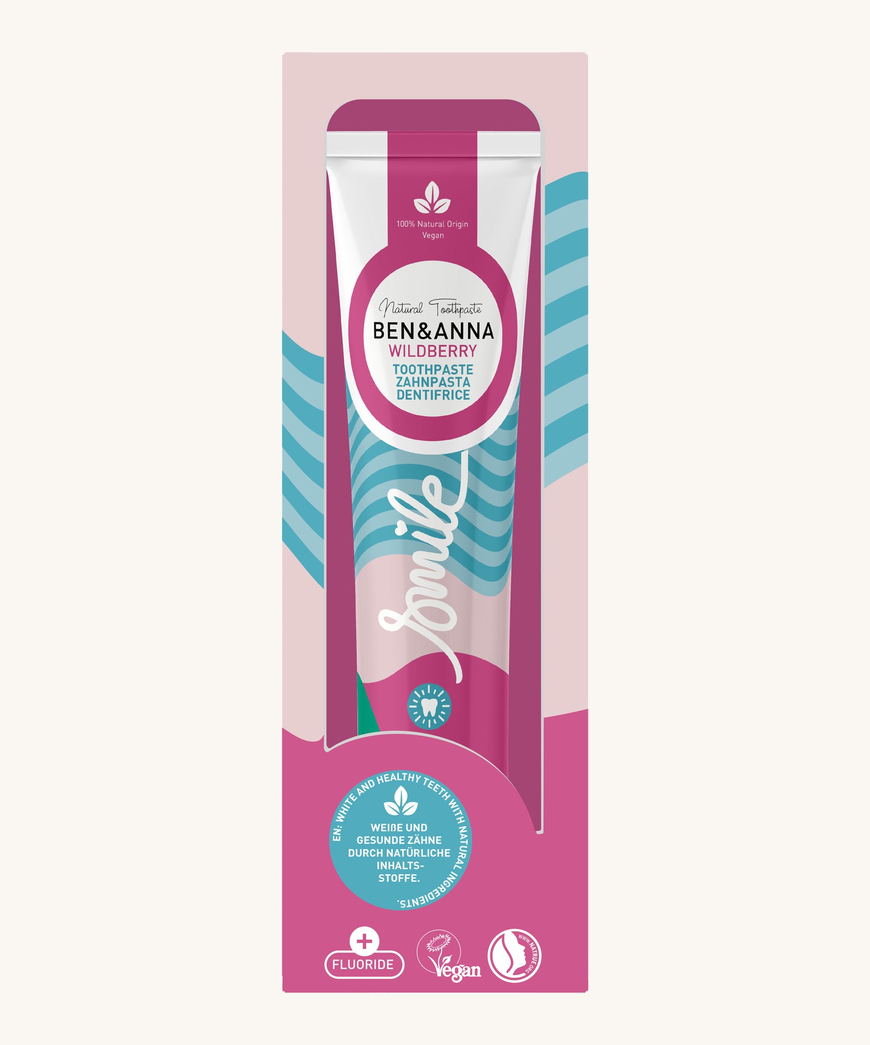 Ben & Anna wild berry toothpaste showing a blue stripe with pink and green wave design on the packing. Features a playful smile slogan in white in the middle.