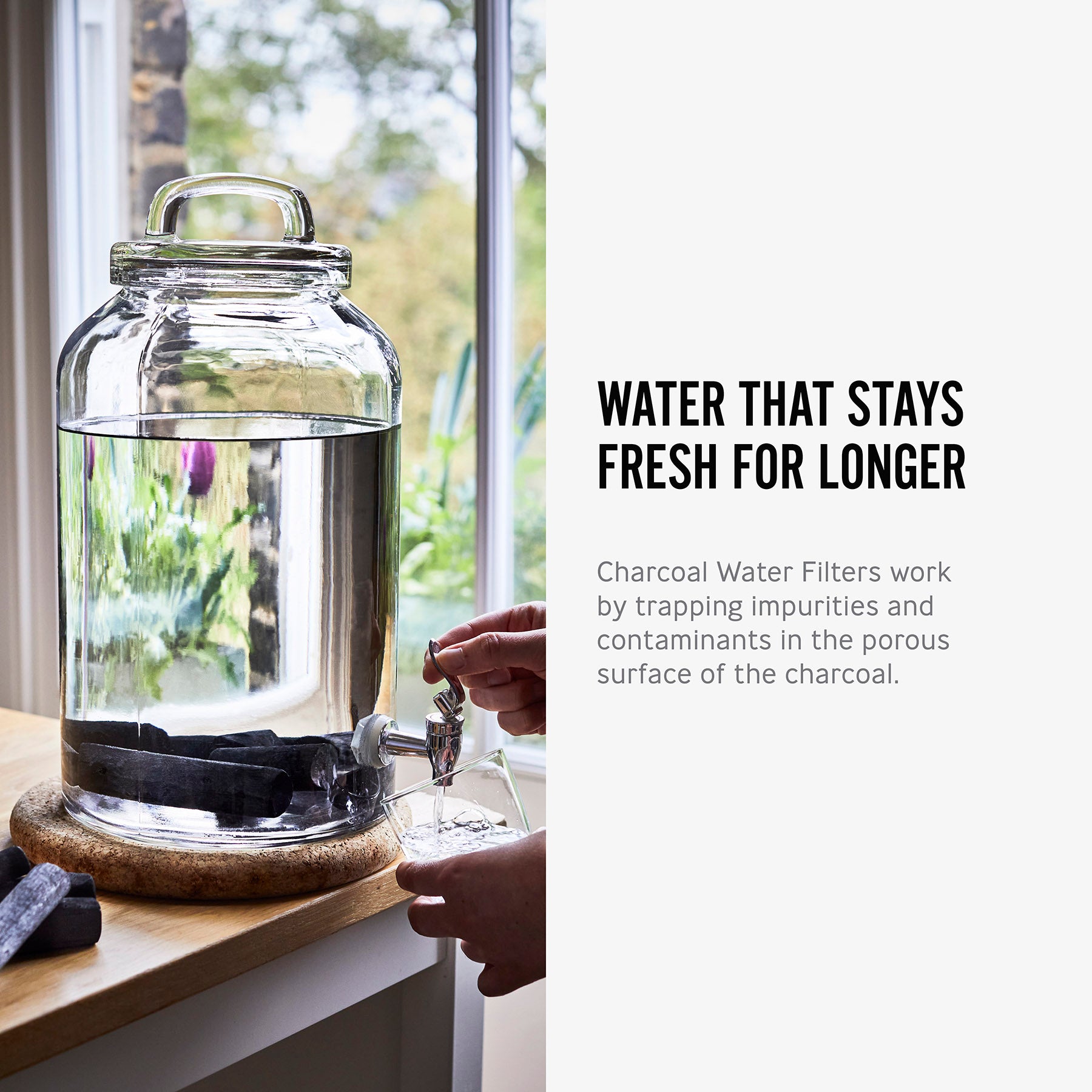 An info graphic featuring an image and text about the Black+Blum Active Charcoal Water Filter. The image shows the charcoal filters in a large glass water dispenser. The text reads, Water that stays fresh for longer. Charcoal water filters work by trapping impurities and contaminants in the porous surface of the charcoal.