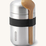 Black + Blum insulated stainless steel food flask with a wooden spoon available at Babipur. Features a black elastic strap to hold the spoon