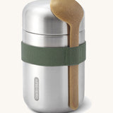 Black + Blum insulated stainless steel food flask with a wooden spoon available at Babipur. Features a olive green elastic strap to hold the spoon