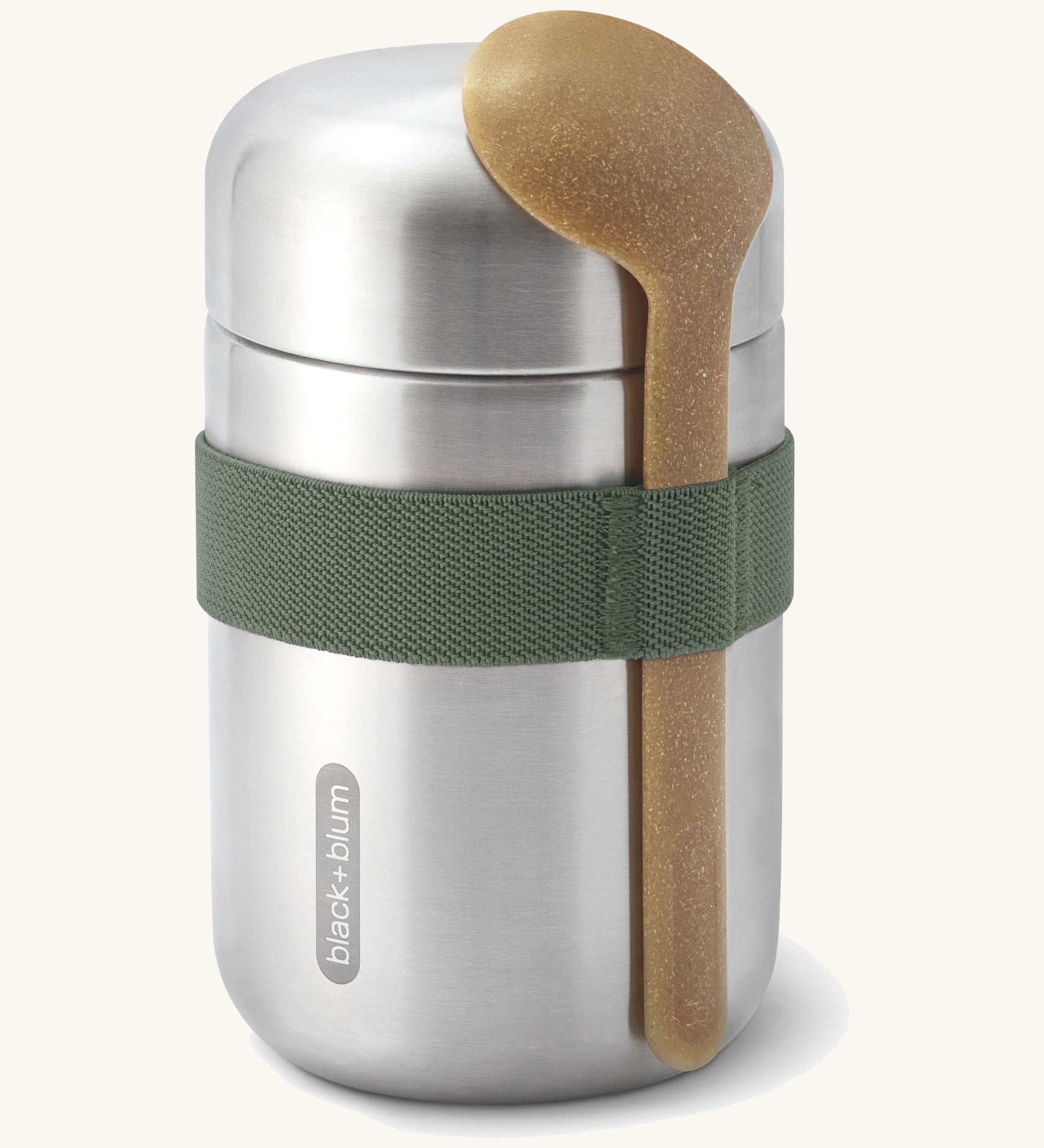 Black + Blum insulated stainless steel food flask with a wooden spoon available at Babipur. Features a olive green elastic strap to hold the spoon