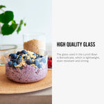 The glass bowl from the Black+Blum Leakproof Microwave Safe Glass Lunch Bowl shown filled with food. The text alongside reads, High quality glass. The glass in the lunch bowl is Borosilicate, which is lightweight, stain resistant and strong.