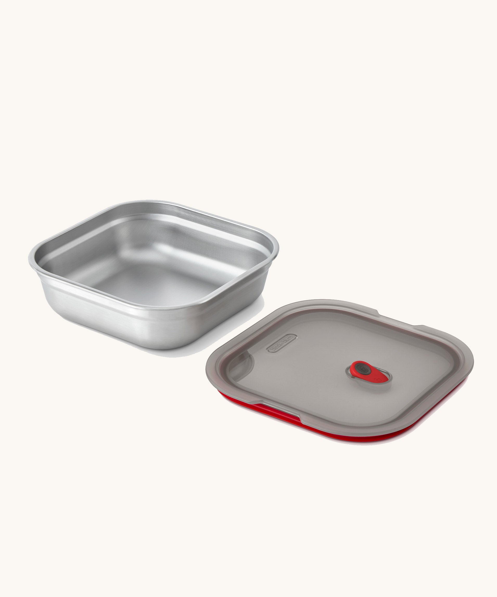A close up of a Black + Blum square stainless steel leakproof microwave safe lunchbox showing the lid detail