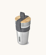 A set of 4 Black + Blum stainless steel cups. Features a handy black carry strap and a protective Bamboo lid