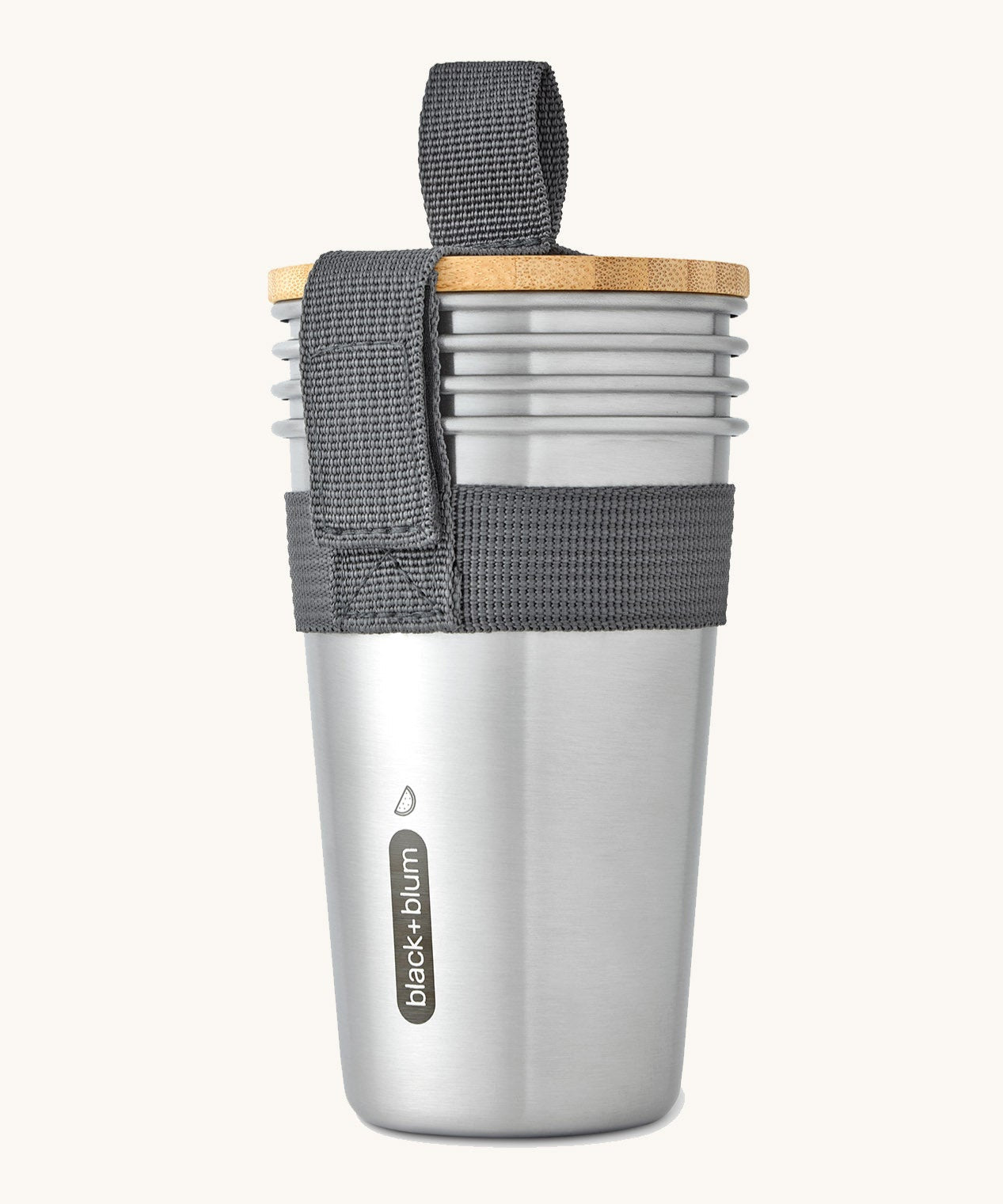 A set of 4 Black + Blum stainless steel cups available at Babipur. Features a handy black carry strap and a protective Bamboo lid which can be used as a bottle opener