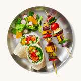 A top down view of the Black + Blum  plates  showing a salad dish on the plate.