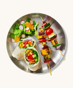 A top down view of the Black + Blum  plates  showing a salad dish on the plate.