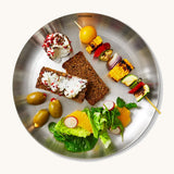 A top down view of the Black + Blum  plates with food  giving an idea on size