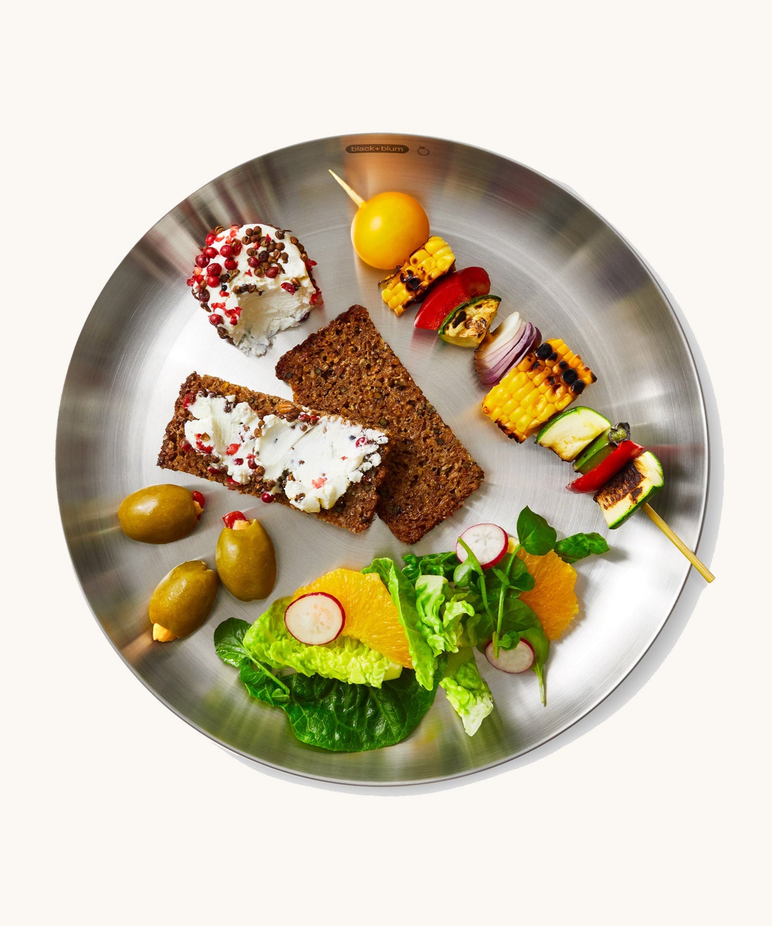 A top down view of the Black + Blum  plates with food  giving an idea on size