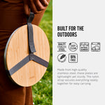 An infographic feating an image, symbols and text. The image is of the plates and board placed in teh strap holder and being carried by a person. The text reads, Built for the outdoors. made from high quality stainless steel, these plates are lightweight yet sturdy. The nylon strap secures everything neatly together for easy carrying. The symbols are for quality stainless steel, easy clean, natural bamboo, dishwasher safe, lightweight and BPA free.