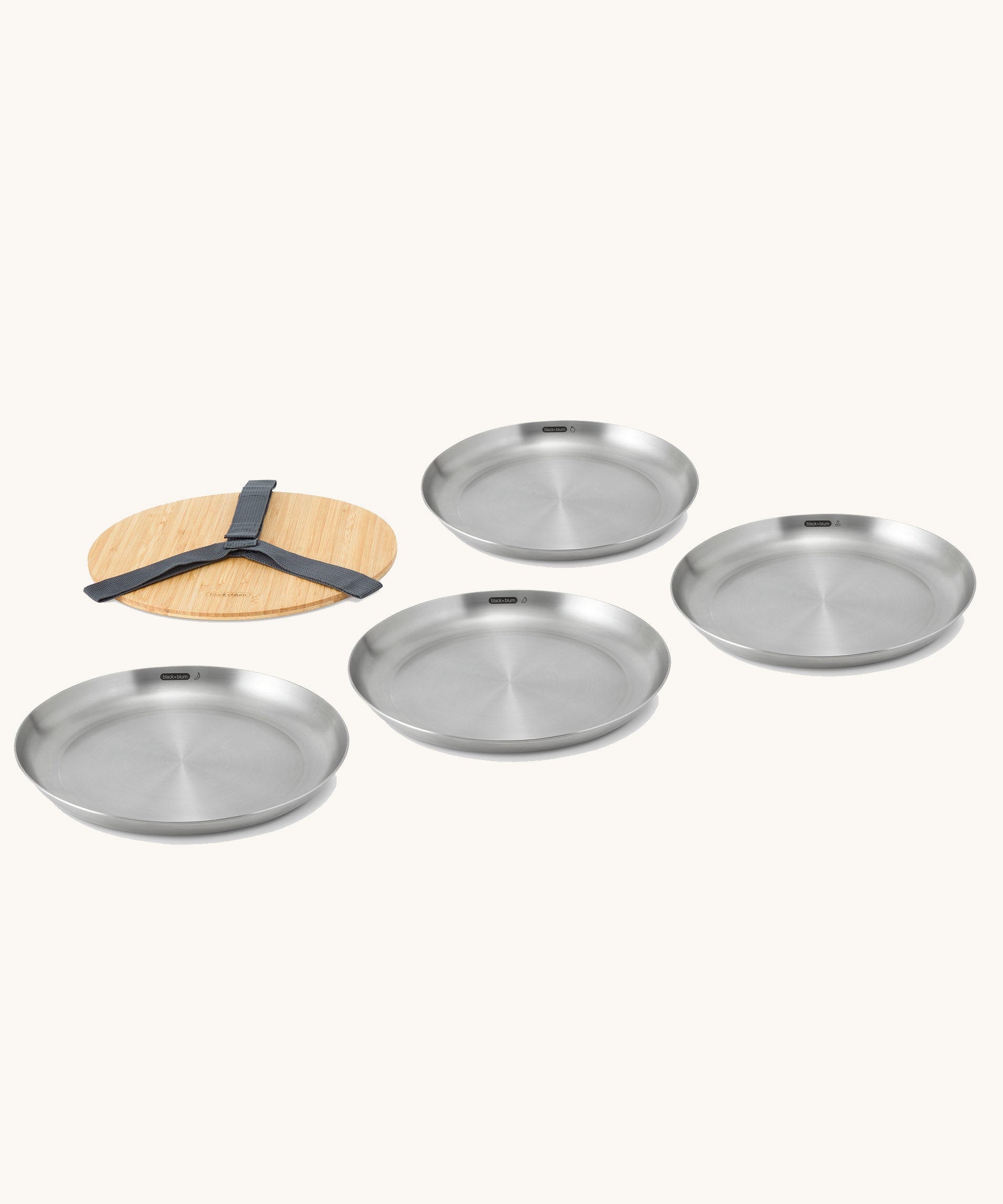 A set of 4 Black + Blum set of  stainless steel plates with a Bamboo protective lid