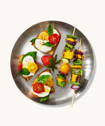 A top down view of the Black + Blum  plates showing various salad foods on the plate