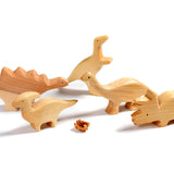 Bumbu childrens handmade natural wooden dinosaur toy figures on a white background