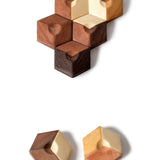 Close up of the hexagonal pieces of the Bumbu sustainable wooden connect puzzle pieces on a white background
