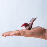 A Bumbu baby Pterandon in a child's hand.