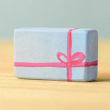 A light blue wooden Bumbu Christmas present.