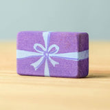 A purple wooden Bumbu Christmas present.
