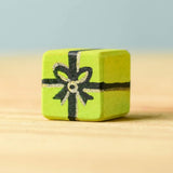A yellow wooden Bumbu Christmas present.