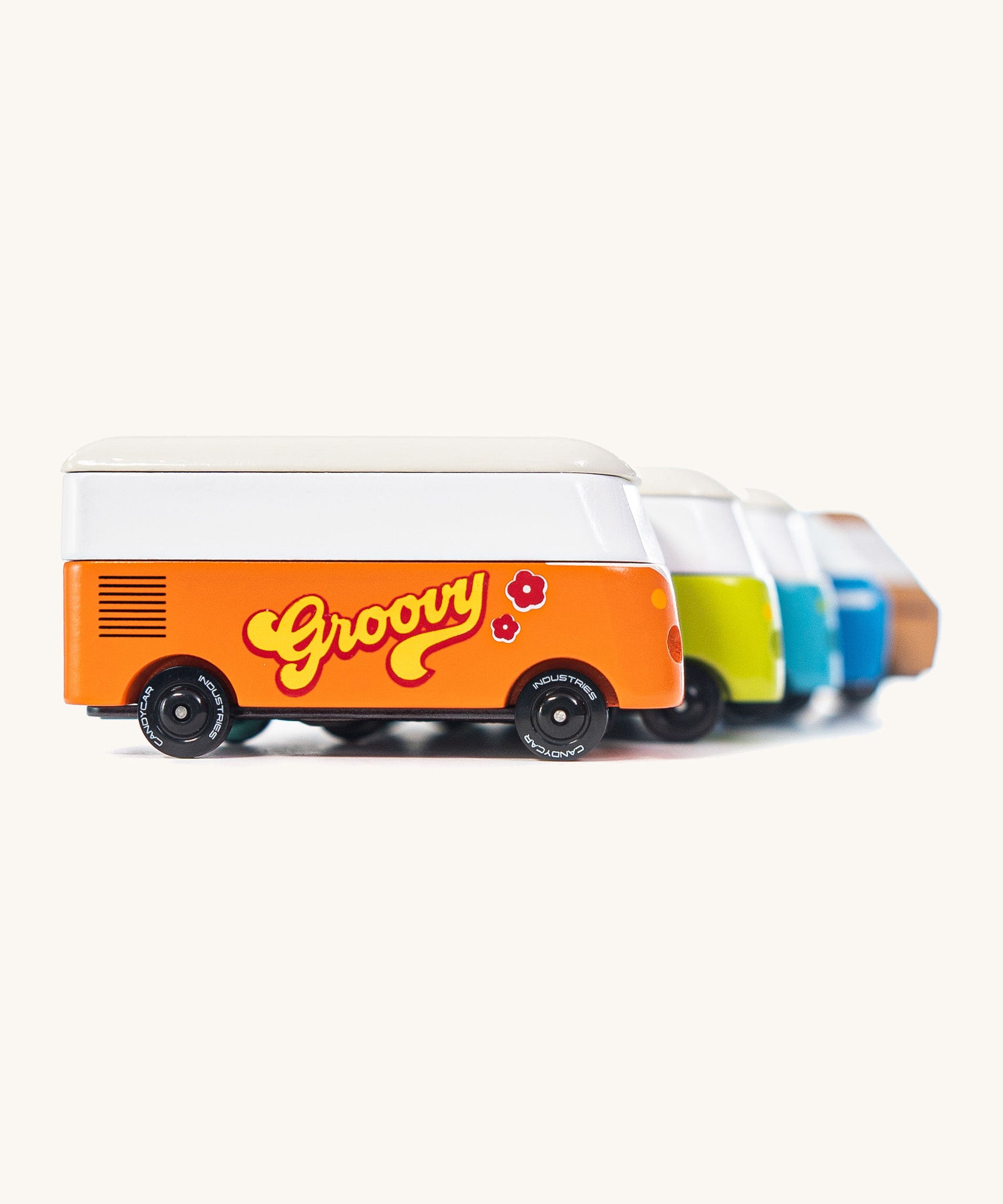 A group shot of 5 different CandyLab Volkswagen CandyVans, all placed one behind the other.