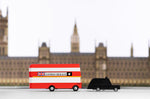 Candylab red double decker bus and black taxi car toys in front of a miniature Buckingham Palace