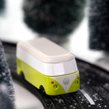 CandyLab green VW T1 Campervan - front  view, driving through a snowy forest.