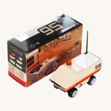 CandyLab cream orange and red Rover space vehicle with the number 56 on the side and a black antenna - with original cardboard packaging.